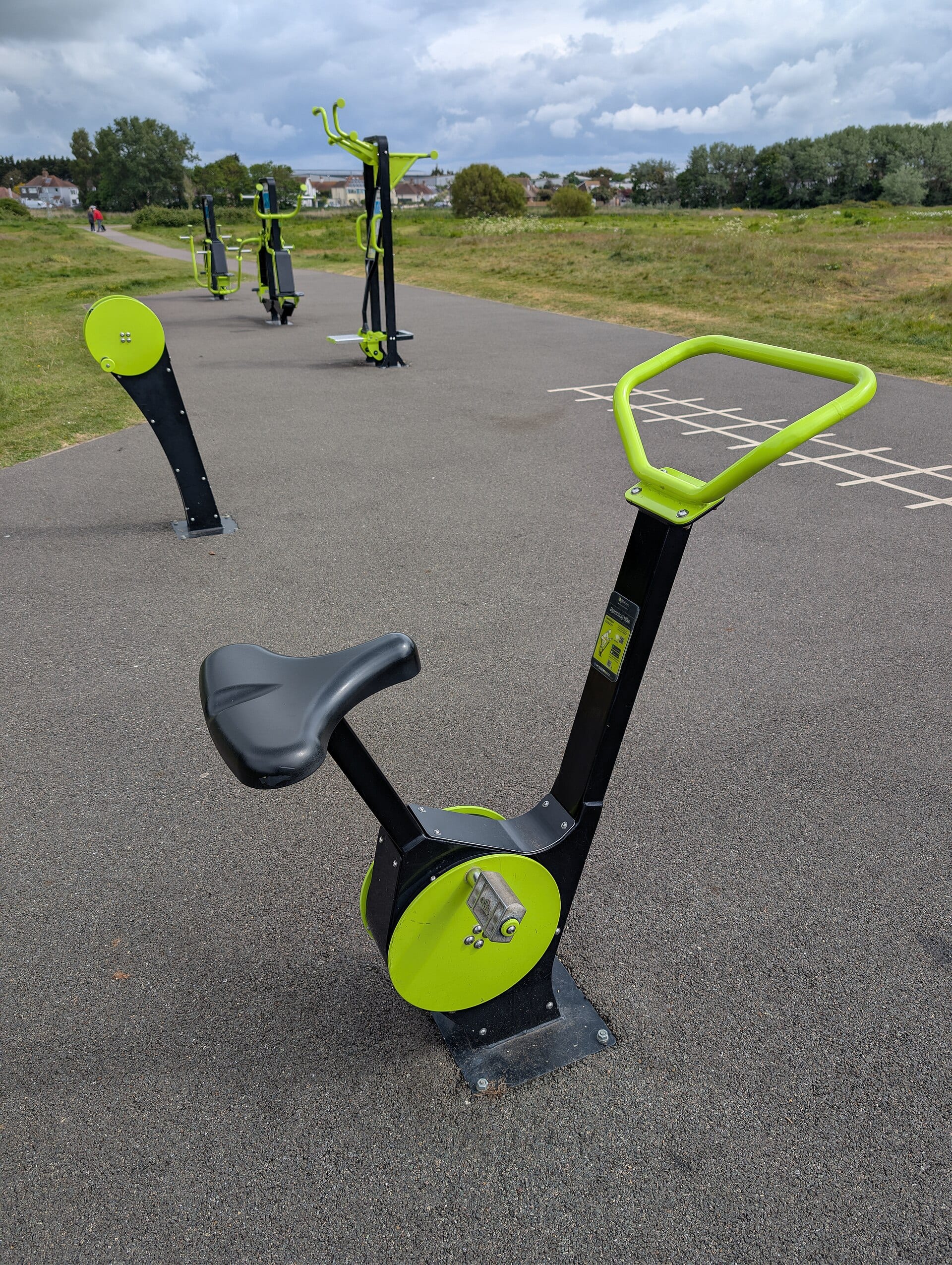 An outdoor exercise bike in a park