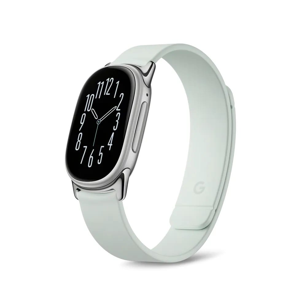 The Fitbit Edge in Fog, a silver case with an analog watch face on a pale green magnetic band