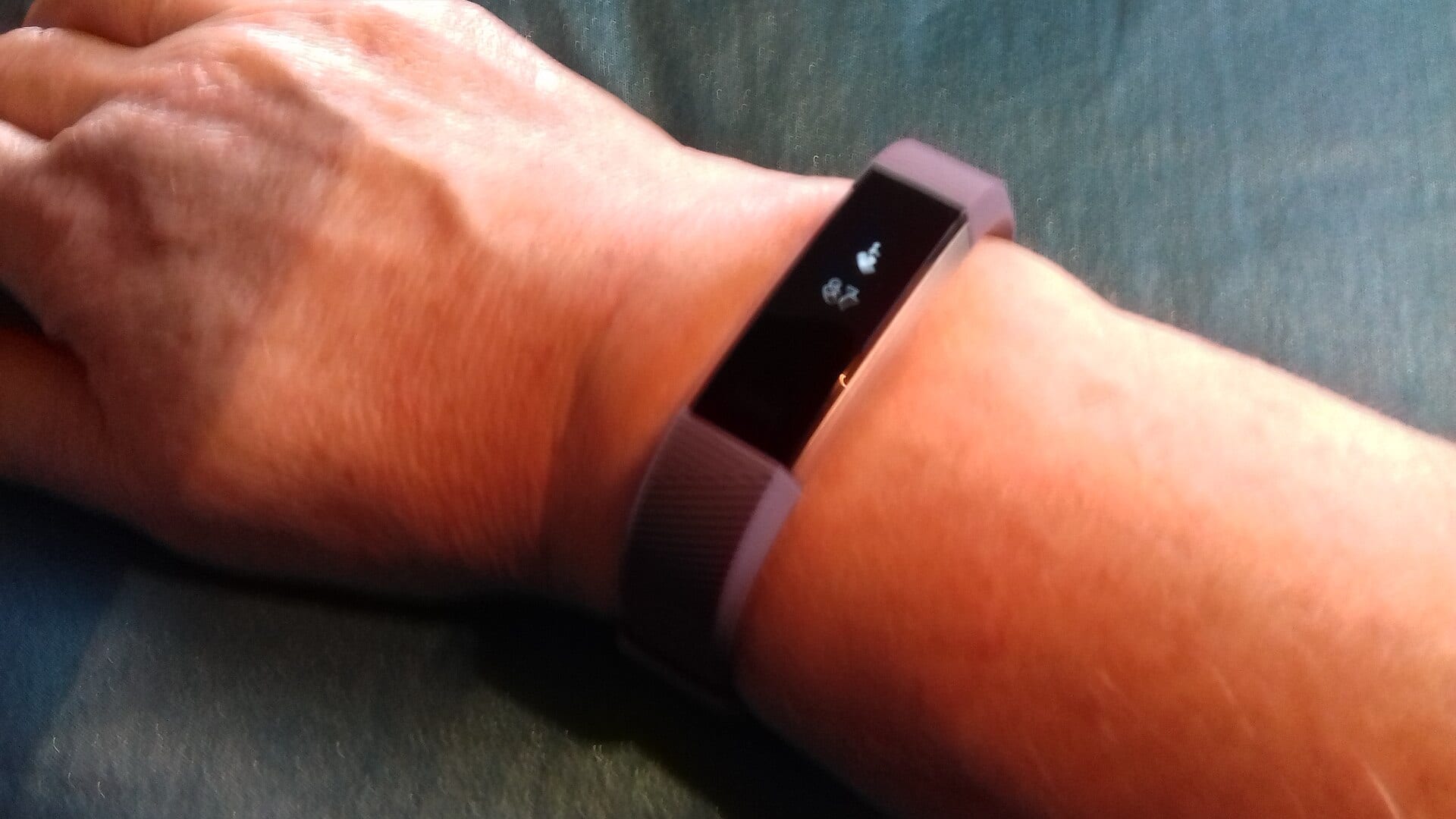 A fitness band worn on a wrist
